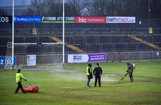 Groundskeepers work on the pitch before the game 16/3/2024