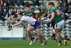 Conor McCarthy tackled by Conor McStay and Darren McHale 24/3/2024