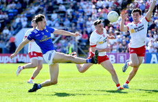 Ruairí Canavan and Conall Devlin fail to stop Brian O'Connell scoring a point 21/4/2024