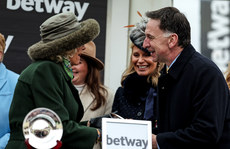 Queen Camilla Parker-Bowles presents Henry De Bromhead with a trophy after winning with Captain Guinness 13/3/2024