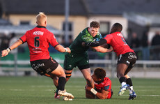 Cathal Forde is tackled by Jordan Hendrikse and Sanele Nohamba 23/3/2024