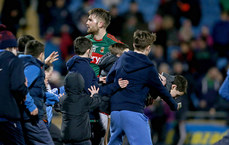 Mayo supporters run to Aidan O'Shea at the end of the game 14/3/2015