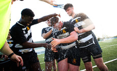 Aindriu Oates is doused in water by teammates Abu Saka and Joshua McCormack after winning the game 21/4/2024