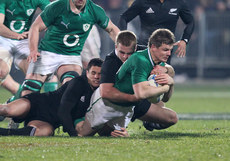 Ireland captain Brian O'Driscoll tackled by Dan Carter and Sam Cane 3/3/2014