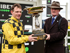 Paul Townend and Willie Mullins lift the Champion Hurdle Challenge Trophy after winning with State Man 12/3/2024
