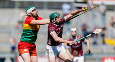 Cathal Mannion gets to the ball ahead of Paul Doyle 21/4/2024