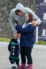 Jamie Heaslip poses for a photograph with Ireland fan Jennifer Malone before training 17/3/2016 