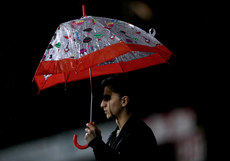 A fan shelters from the rain 10/1/2018