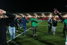 Shamrock Rovers fans are moved onto the pitch after the game after missiles were thrown from outside the ground 19/4/2024