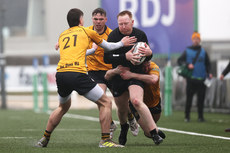 Ian Heanue is tackled by Conor Burns 24/3/2024