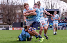 Charlie Molony is tackled by Ethan Black and Sam Corrigan 17/3/2024
