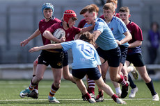 Niall Fleet is tackled by Evan McDonagh and Tomas Higgins 24/4/2024