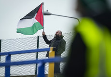 A fan holds up a Palestine flag 10/3/2024