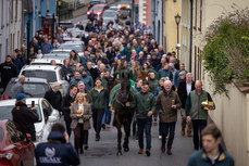Willie Mullins and Paul Townend parade Galopin Des Champs through the village of Leighlinbridge alongside groom Adam Connolly, Shane Jones and owners Greg and Audrey Turley 19/3/2024