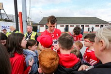 Shane McGuigan signing autographs for fans at the end of the game 24/3/2024