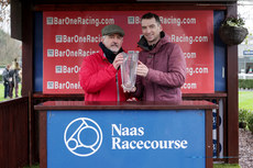 The winning connections are presented with the trophy after the race 10/3/2024
