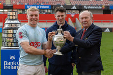 Brian Fitzgerald and Jamie Houston receive the trophy from Michael Carroll 17/3/2024