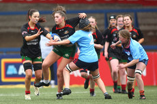 Emer Moroney is tackled by Maggie Murray 13/3/2024
