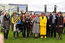 Paul Townend and Willie Mullins celebrate winning the Unibet Champion Hurdle Challenge Trophy alongside the winning connections 12/3/2024