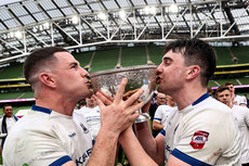 Jack Kelleher and David Hyland kiss the Division 1A trophy 28/4/2024