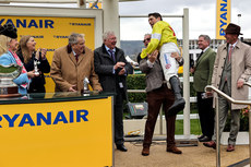 Harry Skelton is lifted in celebration after winning with  Protektorat 14/3/2024