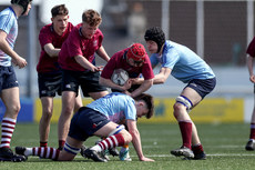 Niall Fleet is tackled by Dylan O Connelly and Stephen Murphy 24/4/2024