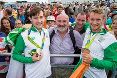 Paul and Gary O'Donovan celebrate winning a silver medal with father Teddy and brother David O'Donovan 12/8/2016