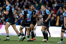 Theo Cabango is congratulated by teammates after scoring a try 19/4/2024