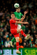 Vincent Sierro and Robbie Brady compete for a high ball 26/3/2024