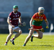 Fiachra Fitzpatrick gets to the ball ahed of David Burke 21/4/2024