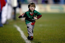 A young Mayo supporter runs onto the pitch at the end of the game 14/3/2015