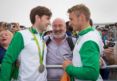 Paul and Gary O'Donovan celebrate winning a silver medal with father Teddy 12/8/2016