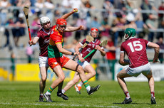 Niall Bolger gets to the ball ahead of Donal O'Shea 21/4/2024