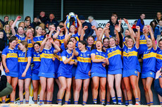The Tipperary team celebrate with the trophy 27/4/2024