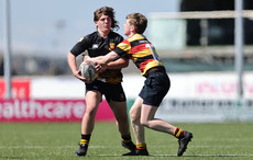 Ciaran West is tackled by Conor O'Hehir 21/4/2024