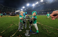 Nico and Jai, sons of James Lowe and Jamison Gibson-Park, with the Guinness Six Nations trophy 16/3/2024