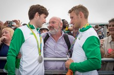 Paul and Gary O'Donovan celebrate winning a silver medal with father Teddy 12/8/2016