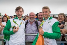 Paul and Gary O'Donovan celebrate winning a silver medal with father Teddy and brother David O'Donovan 12/8/2016