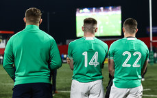 Finn Treacy and Sean Naughton watch the France vs England game out on the pitch after the game 15/3/2024