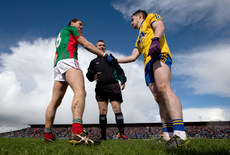 Tom Parsons and Ciaráin Murtagh perform the coin toss with referee Maurice Deegan 27/3/2016