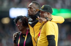  Usain Bolt with his parents, Wellesley and Jennifer Bolt 13/8/2017