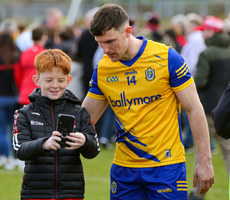 Diarmuid Murtagh stops for a photograph with a young Derry fan 24/3/2024