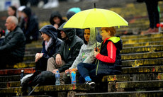 Spectators attempt to stay dry 25/5/2019