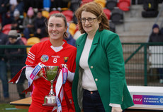  Lauren Homan is presented with the division 2B League Cup by Hilda Breslin of The Camogie Association 23/3/2024