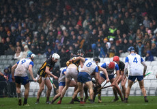 Waterford and Kilkenny players struggle to control a loose ball 16/3/2024