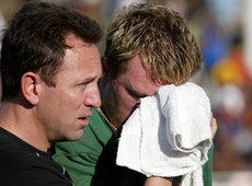 Ailbe McCormack helps off an injured Eric Miller 14/6/2003 00096065 - INPHO_00096065