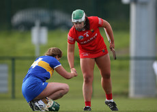 Aoife Barrett shakes hands with Sinead Meagher after the game 23/3/2024