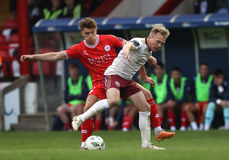 Matthew Smith is tackled by Conor McCormack 28/6/2024