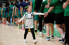 Cora Kelleher high fives the Irish players and staff after the game 27/3/2024