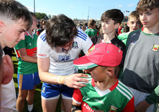 Gary Mohan signs an autograph for a Mayo fan after the game 4/6/2022
